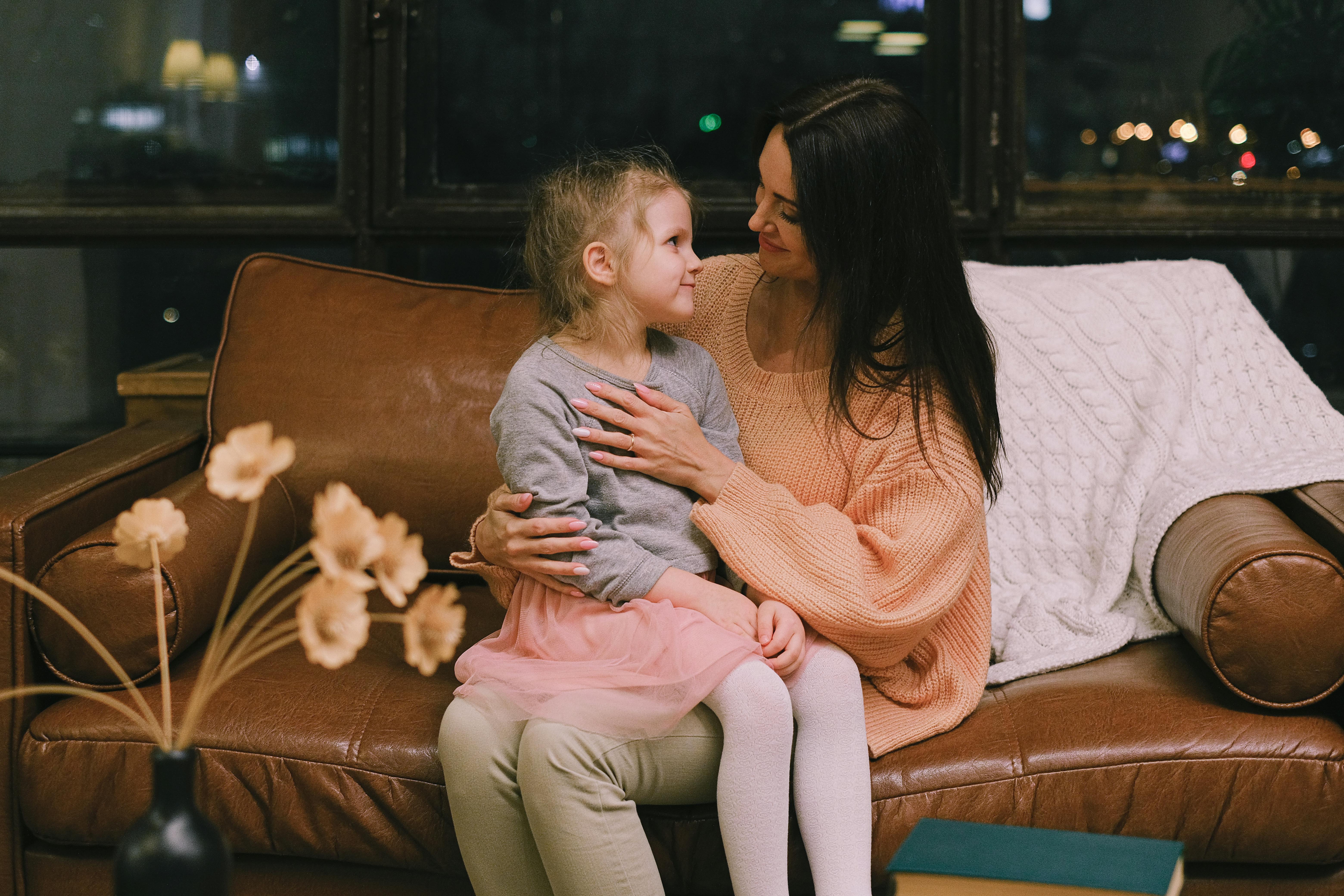 image of a woman holding girl and smiling lovingly. Image from Pexels